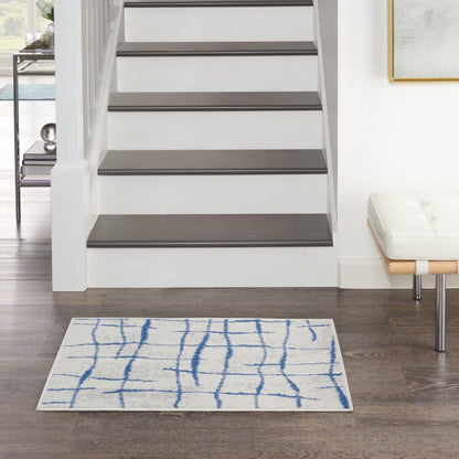 6' X 9' Blue And Ivory Abstract Dhurrie Area Rug